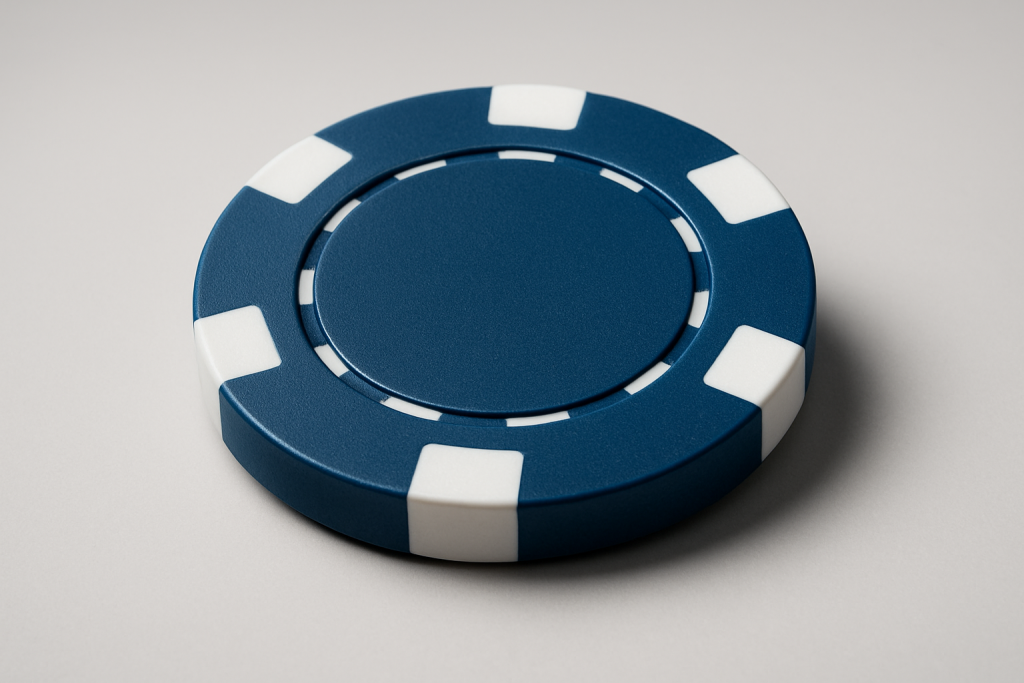 Close-up of a blue poker chip on a neutral background